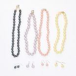 A MIXED LOT OF FOUR NECKLACE AND EARRINGS SETS comprising of a black faux pearl necklace, a pink