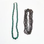 A MIXED LOT OF TWO NECKLACES comprising of a single row of graduated malachite beads, spaced by