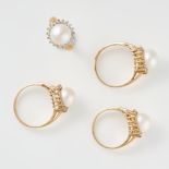 A MIXED LOT OF PEARL RINGS comprising of four pearl and white gemstone cluster rings, stamped 14K,