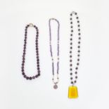 AN ASSORTED LOT OF AMETHYST AND PEARL NECKLACES comprising of a necklace set with alternating