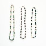 A MIXED LOT OF THREE NECKLACES comprising of a pearl, malachite and silver bead necklace, a pearl,