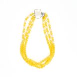 A PEARL AND YELLOW CHALCEDONY BEAD NECKLACE set with three rows of yellow chalcedony beads, accented