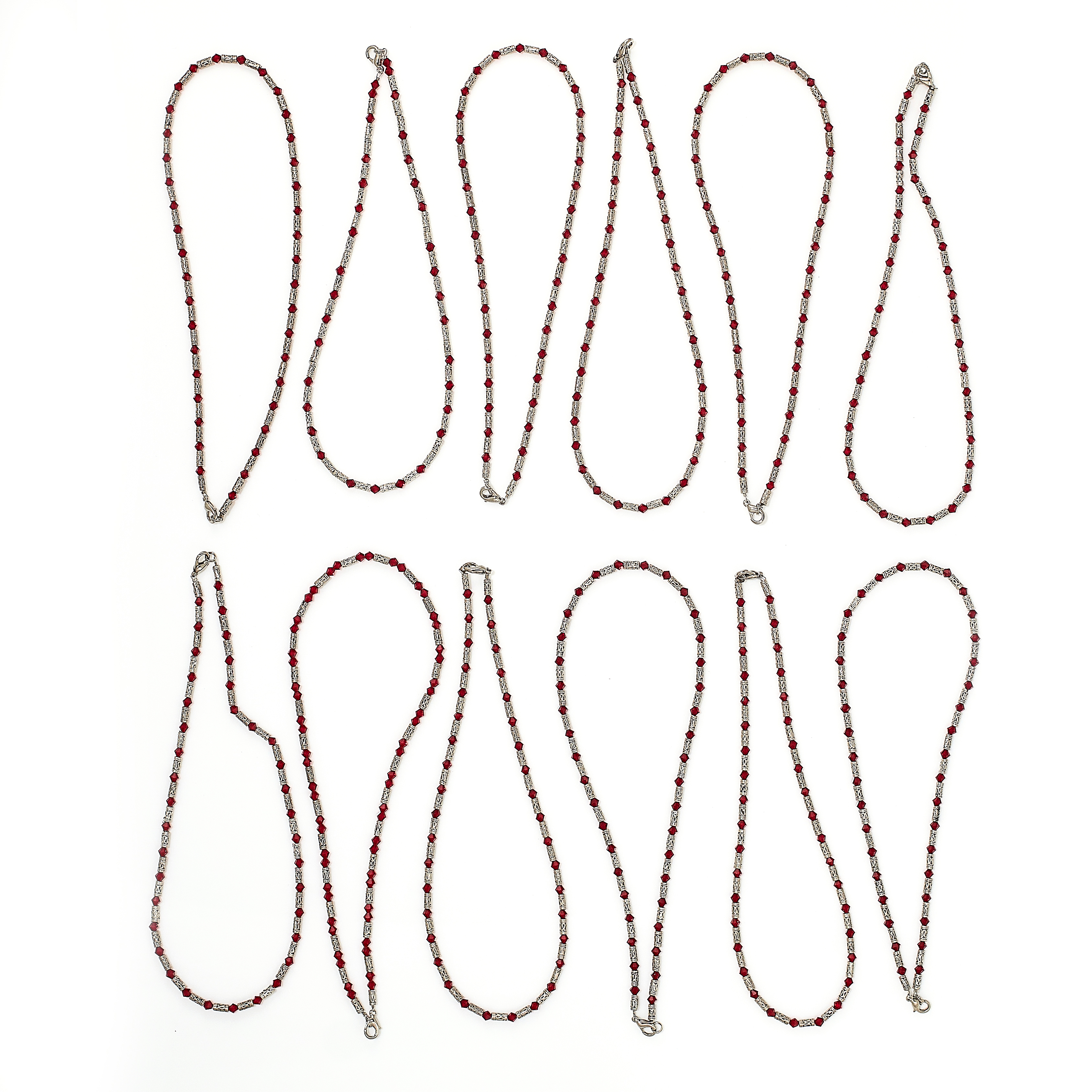 A MIXED LOT OF JEWELLERY comprising of fifteen red glass and silver bead necklaces, three black