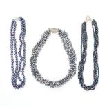 AN ASSORTED LOT OF PEARL NECKLACES comprising of a two row black pearl necklace, a five row black