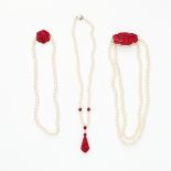 AN ASSORTED LOT OF PEARL AND CORAL NECKLACES comprising of three pearl necklaces, two of which are