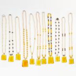 AN ASSORTED LOT OF PEARL NECKLACES comprising of eleven pearl necklaces, some of which are faux,