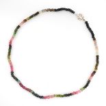 A TOURMALINE NEAD NECKLACE formed of a single row of faceted black, pink, green and light blue