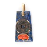 A LAPIS LAZULI AND CORAL PENDANT formed of a trapeze-shaped piece of polished lapis lazuli with an