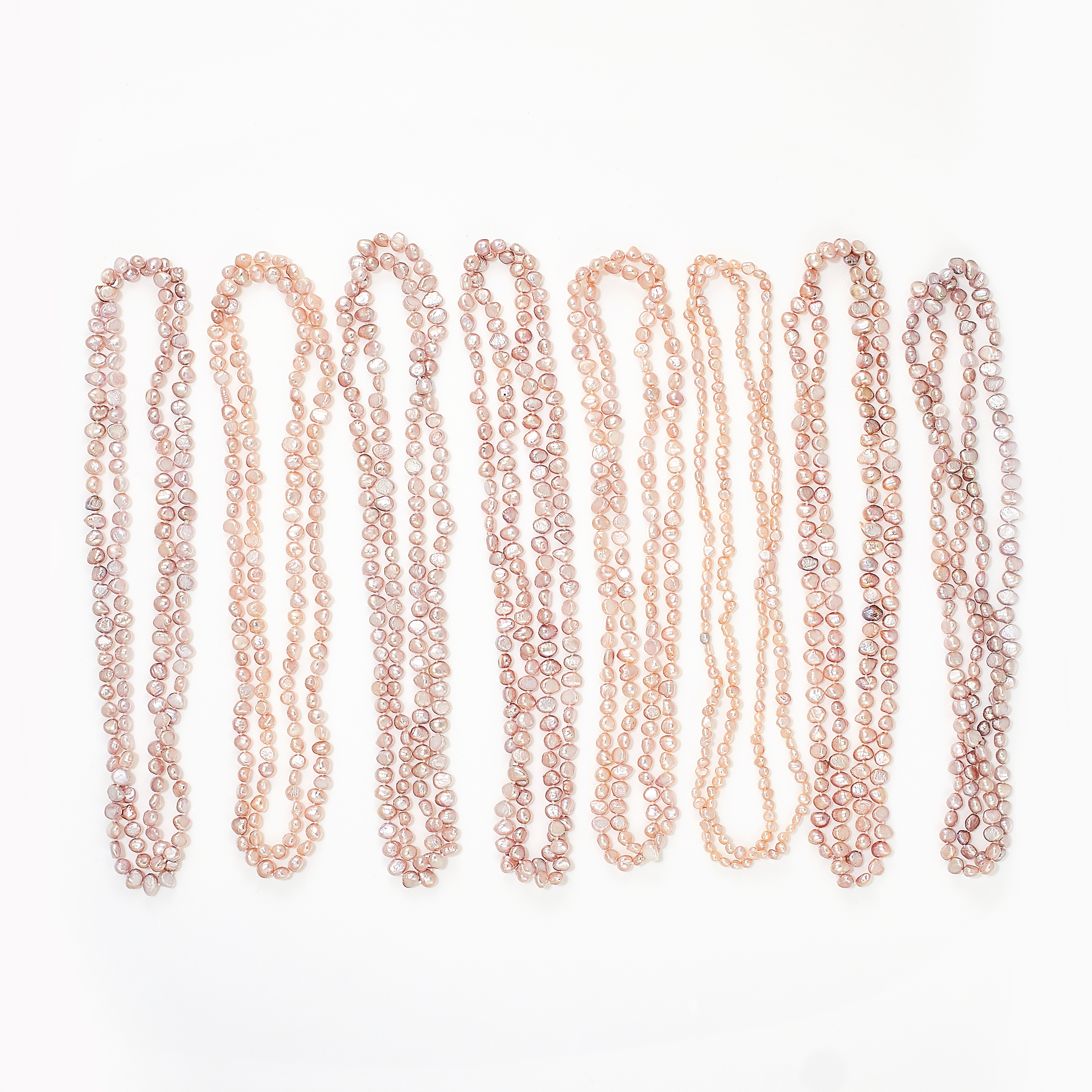 A MIXED LOT EIGHT PINK PEARL NECKLACES comprising of eight necklaces, each formed of a single row of