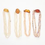 AN ASSORTED LOT OF PEARL AND CARNELIAN NECKLACES comprising of two three row pearl necklaces and two