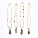 AN ASSORTED LOT OF PEARL AND RUTILATED QUARTZ NECKLACES comprising of four single row pearl