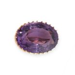 AN ANTIQUE AMETHYST BROOCH  Oval amethyst  Stamped 18CT  Length 20mm  5.3 grams