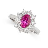 A RUBY AND DIAMOND CLUSTER RING  Made in 18 carat white gold  Oval cut ruby, weighing