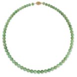 A VINTAGE JADEITE JADE BEAD NECKLACE  Graduated polished jadeite beads ranging 6.7mm to 9.5mm  Clasp