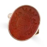 A CARVED CARNELIAN INTAGLIO SEAL / SIGNET RING  Oval polished piece of carnelian reverse carved to
