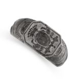 AN ANTIQUE STEEL INTAGLIO SEAL / SIGNET RING  The face reverse carved in detail to depict a coat