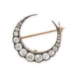 NO RESERVE - A FINE ANTIQUE DIAMOND CRESCENT MOON BROOCH in yellow gold and silver, designed as a