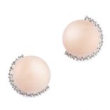 A PAIR OF CORAL AND DIAMOND STUD EARRINGS in 18ct white gold, each set with a polished angel skin