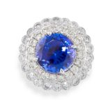 A FINE TANZANITE AND DIAMOND RING in platinum, set with a circular cut tanzanite of 8.04 carats,