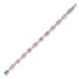 A PINK SAPPHIRE AND DIAMOND BRACELET in 18ct white gold, formed is a series of thirteen cluster