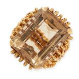 A VINTAGE CITRINE DRESS RING set with an emerald cut citrine of 19.0 carats, within a twisted