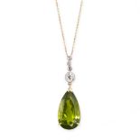 A PERIDOT AND DIAMOND PENDANT NECKLACE in 18ct yellow gold, set with a pear cut peridot of 8.42