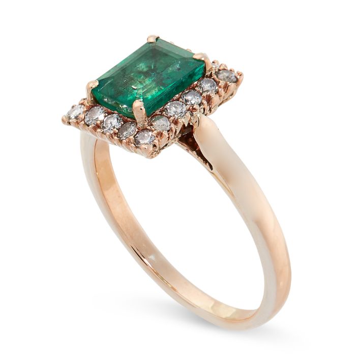 AN EMERALD AND DIAMOND RING set with an emerald cut emerald of 1.10 carats in a cluster of round cut - Image 2 of 2
