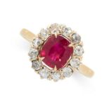A RUBY AND DIAMOND CLUSTER RING set with a cushion cut ruby weighing 1.36 carats in a cluster of old