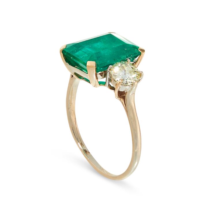 A COLOMBIAN EMERALD AND DIAMOND RING set with an emerald cut emerald of 4.54 carats between a two - Image 2 of 2