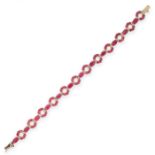 A RUBY BRACELET designed as an articulated line of annular links pave set with round cut rubies,