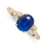 A SAPPHIRE AND DIAMOND RING set with an oval cut sapphire of 1.93 carats accented by trios of