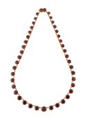 A 9CT GOLD GARNET RIVIERE NECKLACE