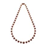 A 9CT GOLD GARNET RIVIERE NECKLACE