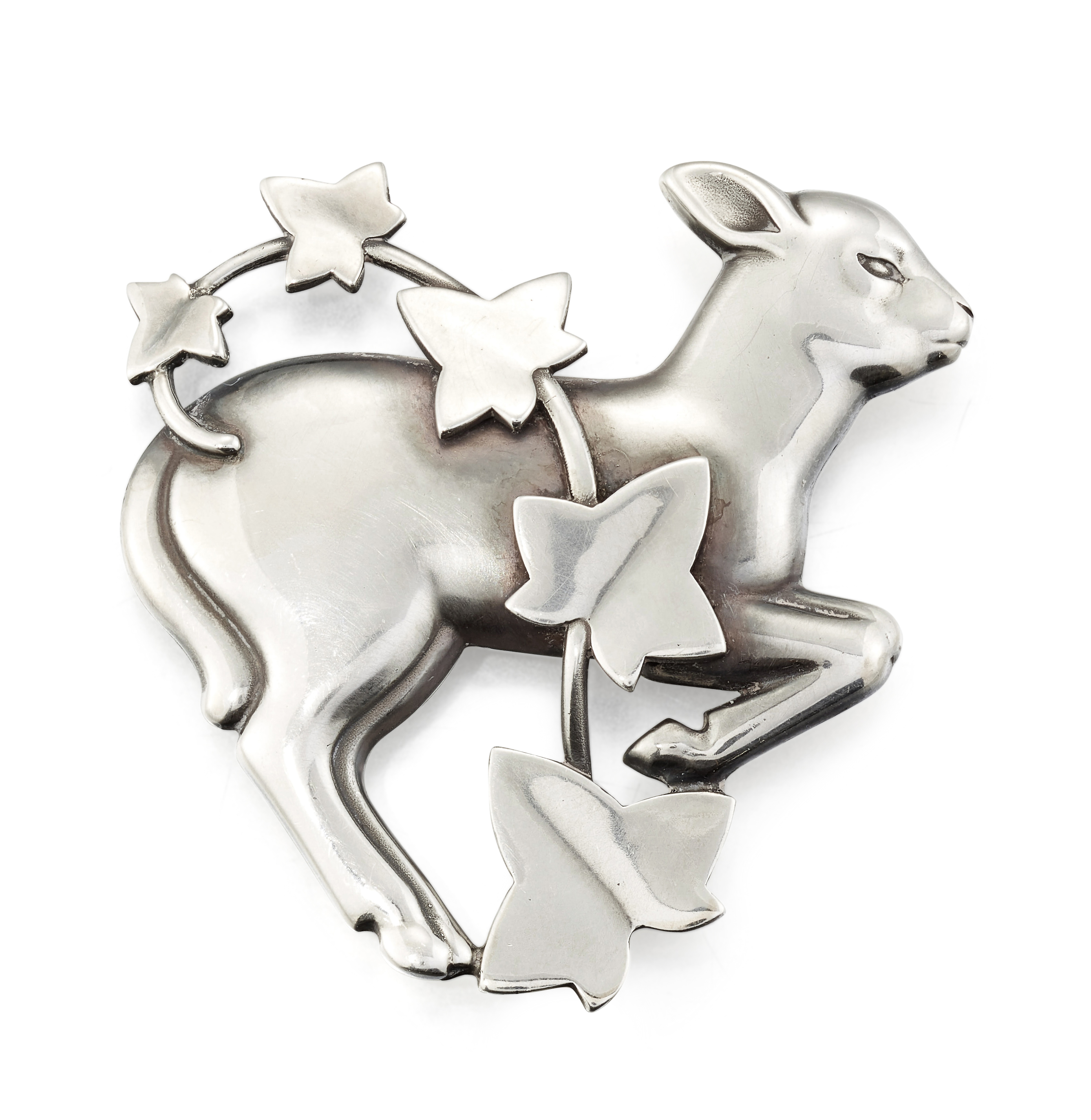 A GEORG JENSEN 'MIDNIGHT LAMB AND IVY' BROOCH, No. 311 BY ARNO MALINOWSKI