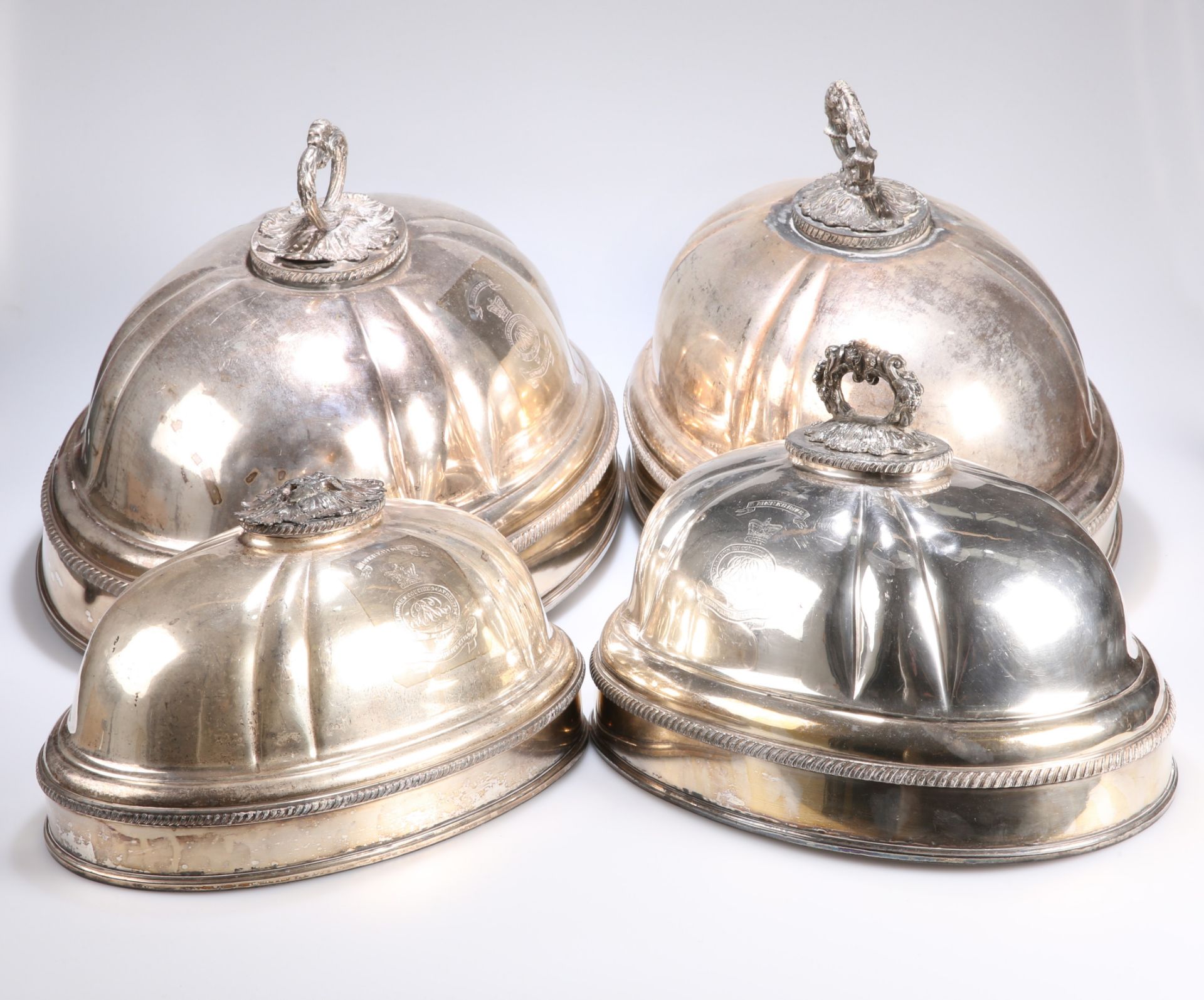 ^ TWO PAIRS OF SILVER-PLATED MEAT COVERS