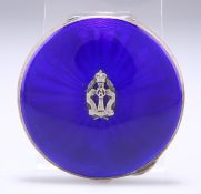 AN ELIZABETH II SILVER AND ENAMEL COMPACT