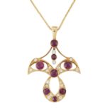 AN EARLY 20TH CENTURY GARNET AND DIAMOND PENDANT ON CHAIN