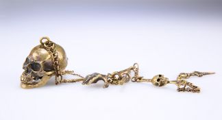 A NOVELTY BRASS ALBERT CHAIN AND SKULL FOB