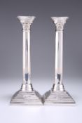 A PAIR OF ELIZABETH II SILVER COLUMNAR CANDLESTICKS