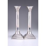 A PAIR OF ELIZABETH II SILVER COLUMNAR CANDLESTICKS