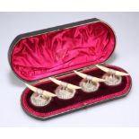 A SET OF FOUR VICTORIAN SILVER AND IVORY KNIFE RESTS