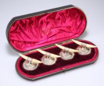 A SET OF FOUR VICTORIAN SILVER AND IVORY KNIFE RESTS