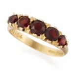 AN 18CT GOLD GARNET FIVE STONE RING