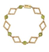 AN EDWARDIAN PERIDOT AND SEED PEARL BRACELET