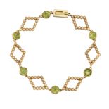 AN EDWARDIAN PERIDOT AND SEED PEARL BRACELET