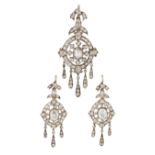 A DIAMOND PENDANT AND EARRING SUITE