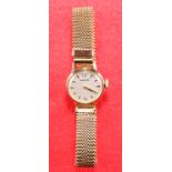 A LADY'S 9 CARAT GOLD GARRARD BRACELET WATCH