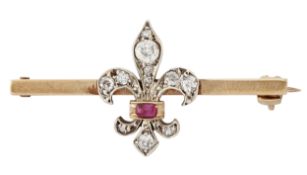 A DIAMOND AND RUBY FLEUR DE LIS BROOCH