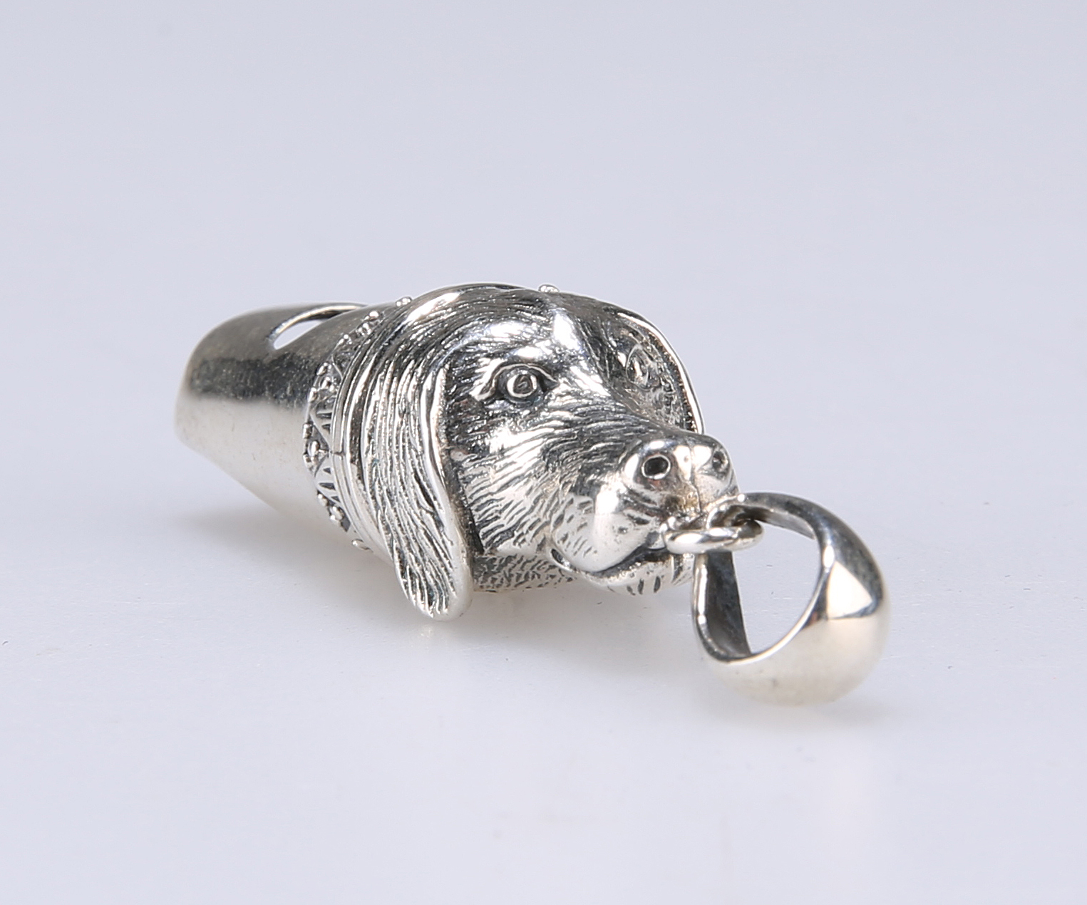 A NOVELTY SILVER DOG WHISTLE