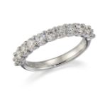 AN 18CT WHITE GOLD DIAMOND HALF HOOP RING